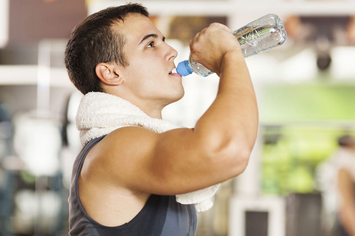 An image featuring a fitness enthusiast drinking a post-workout
