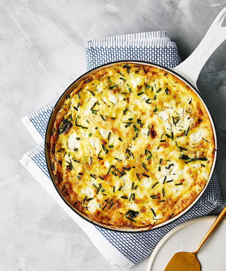 A sausage and goat cheese frittata still in the baking pan