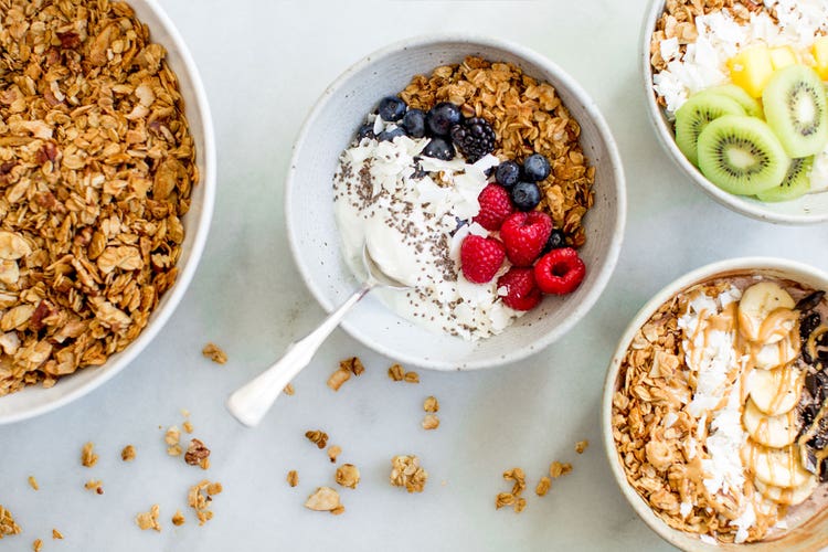 Healthy granola bowls filled with yogurt and fruit