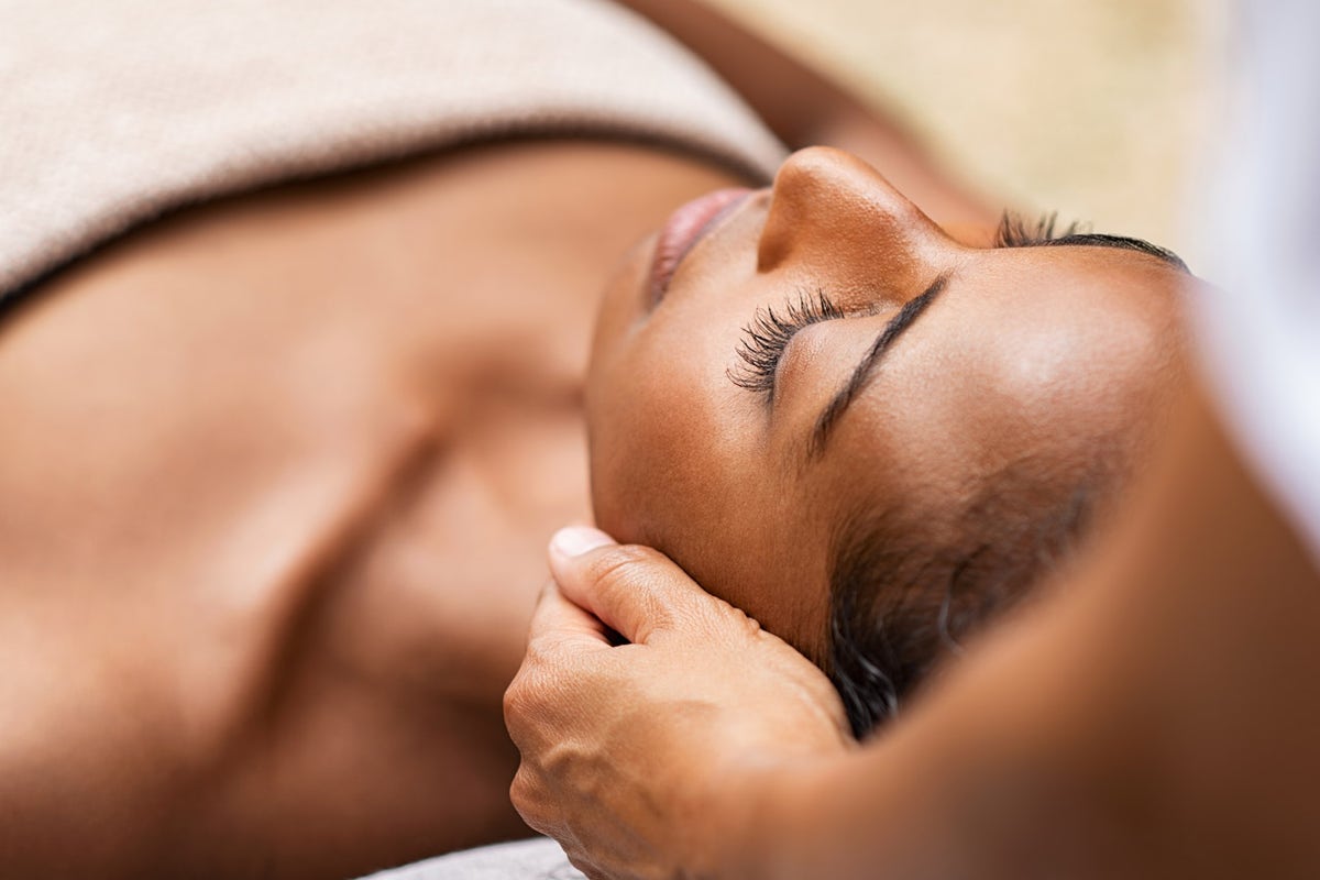 Relax Lower Back Massage Stock Photo by microgen